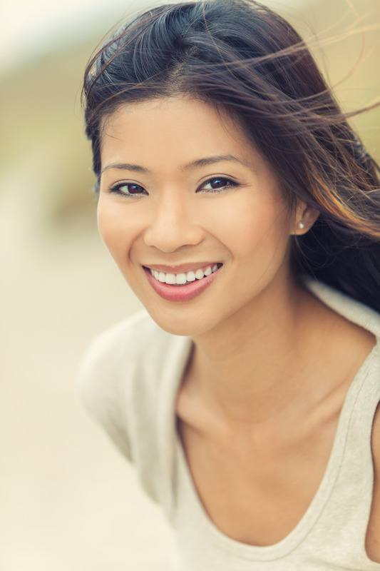 Outdoor portrait of a beautiful young Chinese Asian young woman 